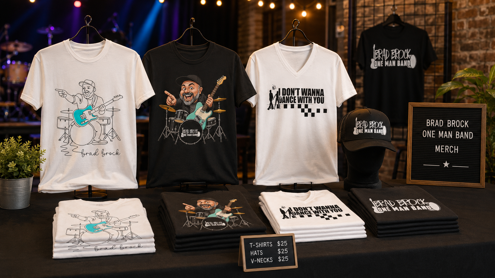 Brad Brock One Man Band shirts and hats on a merch table